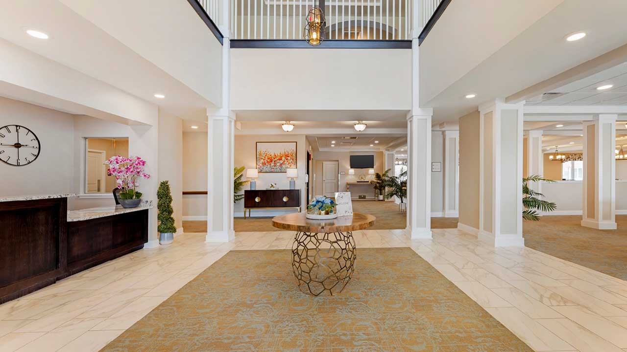 Grand two-story lobby with elegant columns and natural light